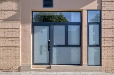 a pair of glass doors on a brick building at Romantic Suite Roig Arena N4 Virkin Suites in Valencia