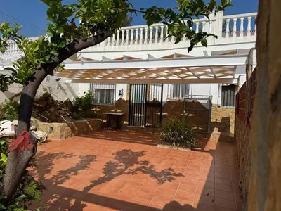a large swimming pool with blue water at La casa del señorito in Tous