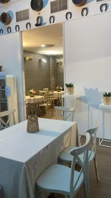 a dining room with a table and chairs at Hostal Casa Sifre in Villanueva de Castellón