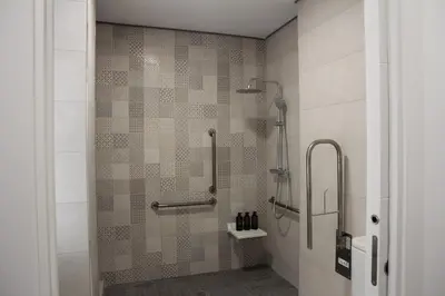 a bathroom with a shower with a glass door at A Malilla&Ruzafa in Valencia