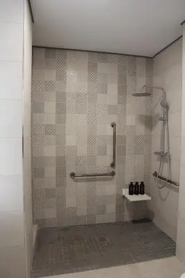 a shower in a bathroom with a tiled wall at A Malilla&Ruzafa in Valencia