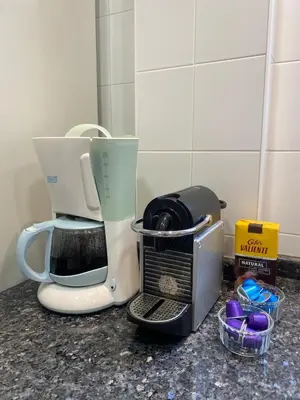 a kitchen counter with a coffee maker and a blender at Domus Belle Home Valencia in Foyos