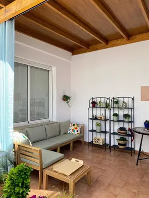 a living room with a couch and a table at Domus Belle Home Valencia in Foyos
