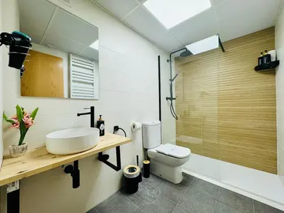 a bathroom with a sink and a toilet at ABAT 1 Cool & Wide Flat next to the Cathedral in Valencia