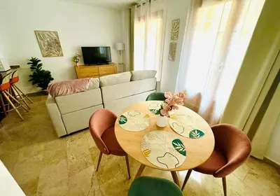 a living room with a wooden table and chairs at ABAT 1 Cool & Wide Flat next to the Cathedral in Valencia