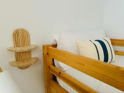 a room with a wooden bunk bed with a shelf at ABAT 1 Cool & Wide Flat next to the Cathedral in Valencia