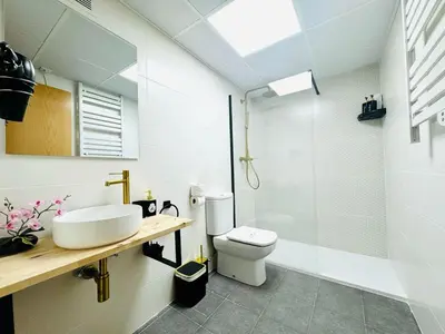 a bathroom with a sink and a toilet and a shower at ABAT 2 Cool & Wide Flat next to the Cathedral in Valencia