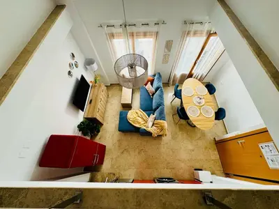 a living room with a couch and a table at ABAT 3 Cool & Wide Duplex Next to the Cathedral in Valencia