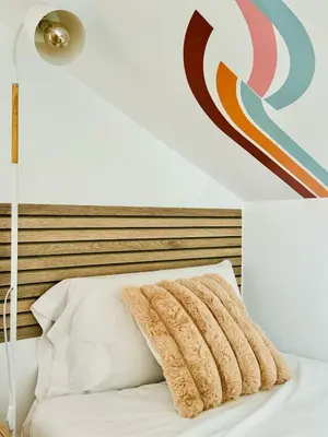 a bedroom with a bed with a headboard and a lamp at ABAT 3 Cool & Wide Duplex Next to the Cathedral in Valencia