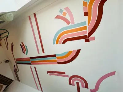 a room with a rainbow mural on the wall at ABAT 3 Cool & Wide Duplex Next to the Cathedral in Valencia