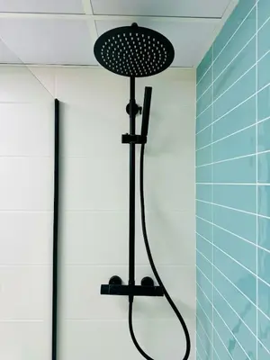 a shower with a shower head in a bathroom at ABAT 4 Cool & Wide Studio in the Historic Center in Valencia
