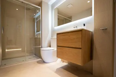 a bathroom with a toilet and a glass shower at City of Arts Valencia Flats by Rent Me in Valencia