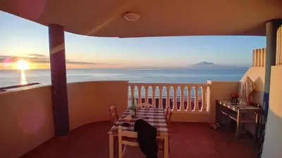 a balcony with a table and a view of the ocean at vistas panoranicas al mar desde su terraza in Moncófar