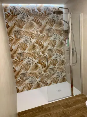 a shower in a bathroom with a wall at Central Park Flats by VIVOGC in Valencia