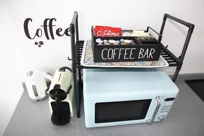 a coffee bar on top of a microwave at Ruzafa Alegria in Valencia