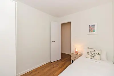 a bedroom with two beds and a closet at GuestReady - Your Sunny Valencia Basecamp in Valencia