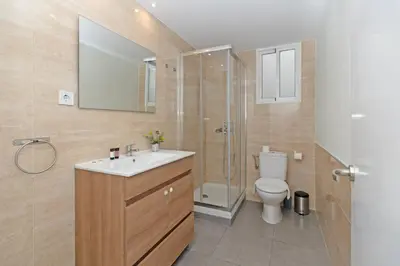 a bathroom with a toilet and a sink and a shower at GuestReady - Your Sunny Valencia Basecamp in Valencia