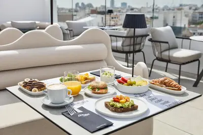 a tray of food on a table with breakfast foods at One Shot Puerta Ruzafa in Valencia