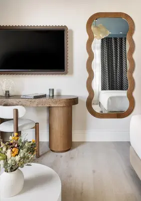 a living room with a tv and a mirror at One Shot Puerta Ruzafa in Valencia