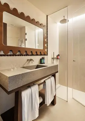 a bathroom with a sink and a mirror at One Shot Puerta Ruzafa in Valencia