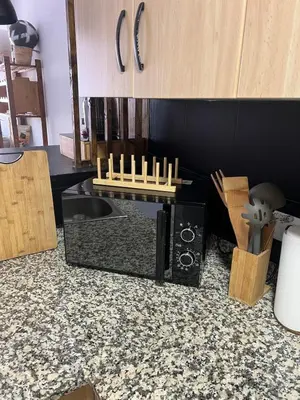 a kitchen with a counter with some candles on it at Apartment with the pool in Moncófar