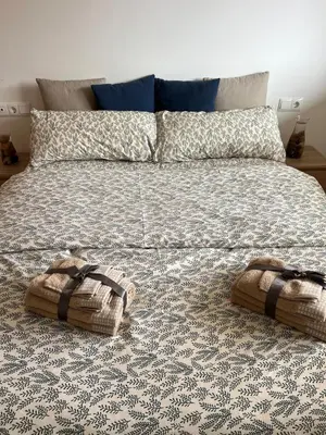 a bed with two baskets on top of it at Apartment with the pool in Moncófar