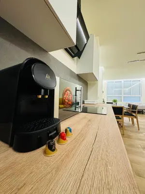 a computer sitting on a table in a room at Suite Palacio Congresos in Valencia