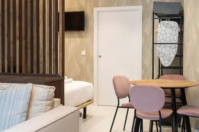 a bedroom with a bed and a table and chairs at VLC HOST - Palleter in Valencia