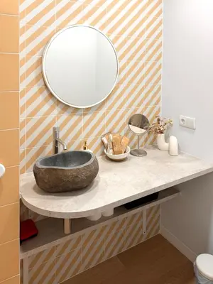 a bathroom with a sink and a mirror at Exclusive beachfront apartment in Valencia