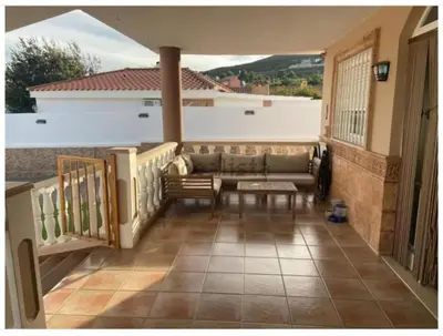 a bedroom with a bed with two slippers on it at Villa entre terre et mer in Montroy
