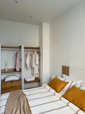 a bedroom with two beds and a closet at Apartamento en Valencia Ruzafa in Valencia