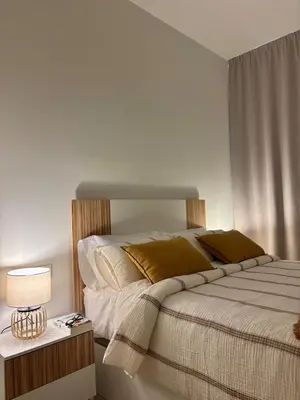 a bedroom with a bed and a table with a lamp at Apartamento en Valencia Ruzafa in Valencia