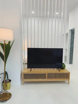 a living room with a flat screen tv on a bench at Apartment 1 City of Arts and science Fast Wifi 1 in Valencia