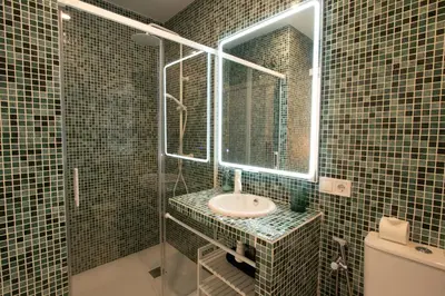 a bathroom with a sink and a mirror at Apartment 1 City of Arts and science Fast Wifi 1 in Valencia