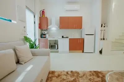 a living room with a couch and a kitchen at Apartment 2 City of Arts and Science Fast Wifi 2 in Valencia
