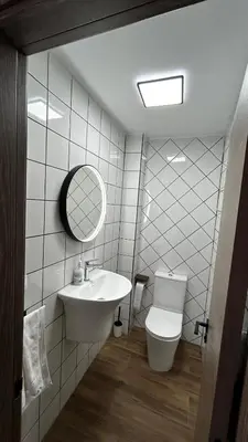 a bathroom with a sink and a toilet and a mirror at Vistas del Frailecico in Chulilla
