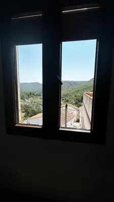 two windows in a room with a view of a city at Vistas del Frailecico in Chulilla