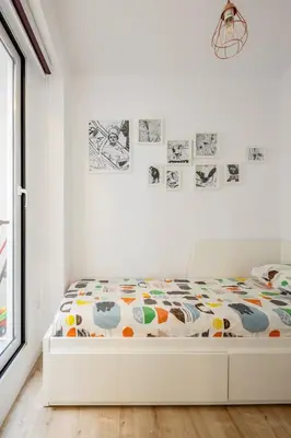 a white bedroom with a bed in a room at GuestReady - Homely escape in Valencia in Valencia