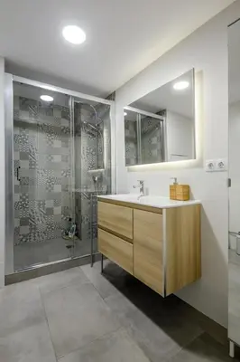 a bathroom with a sink and a shower at GuestReady - Homely escape in Valencia in Valencia