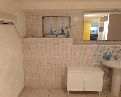 a bathroom with a sink and a mirror at Ferienwohnung mit Privatpool Casa Wende in Benaguacil