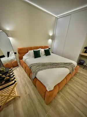 a bedroom with a large bed in a room at Tao Suite 2 next to the Aquarium in Valencia