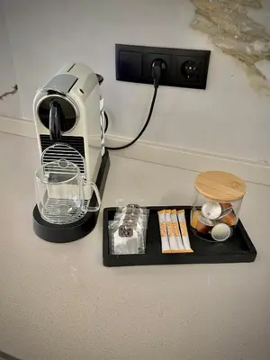 a food processor sitting on a black tray with food at Tao Suite 2 next to the Aquarium in Valencia