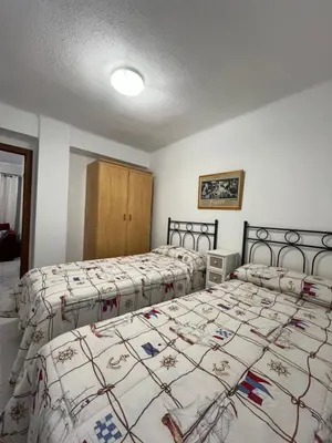 a bedroom with two beds in a room at Apartamento Torres Serranos in Valencia