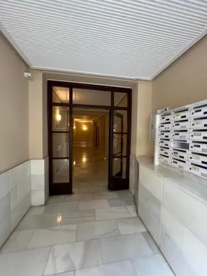 an empty room with a door and a hallway at Apartamento Torres Serranos in Valencia