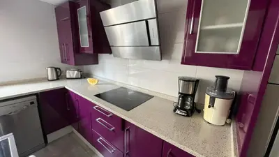 a kitchen with purple cabinets and a blender on the counter at Flat close to beach perfect for families and groups - Isidro B 3 in Valencia