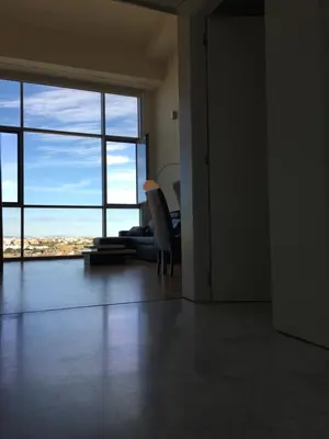 an empty room with a large window and a chair at Panoramic Suites By VALENCIAFLATS EU in Valencia