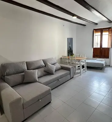 a living room with a couch and a table at Piso 1 - Apartamento Mercado Central in Valencia