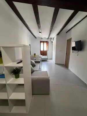 a living room with a couch and a table at Piso 1 - Apartamento Mercado Central in Valencia