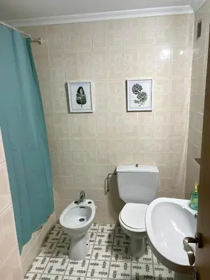 a bathroom with a toilet and a sink at Apartment on Sueca Beach Mis Gaviotas in Mareny Barraquetas