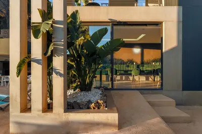 a house with a potted plant on the side of it at Resort Serra Nature - Luxury Villas Hotel Boutique in Serra